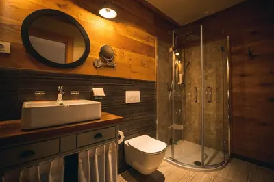 a bathroom with a toilet and a sink and a shower at Hotel Zamorc in Škofja Loka