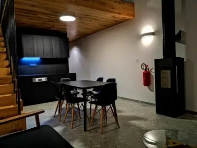 a dining room with a table and chairs at Apartments Cokla Zero in Zreče