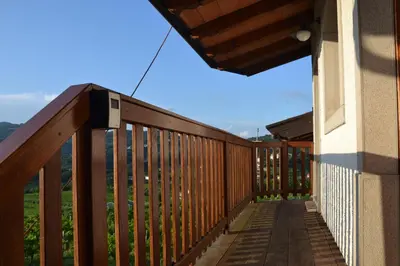 a deck with a view of the mountains at Pri Marjotu in Kojsko