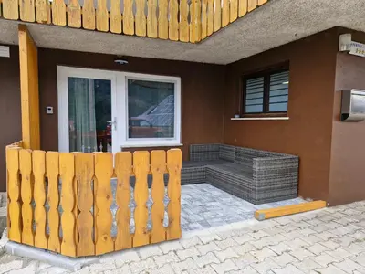 a wooden fence in front of a house at Apartma Vovk in Mojstrana