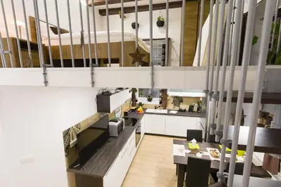 a kitchen with a table and a kitchenasteryasteryasteryasteryasteryasteryasteryastery at Sweet getaway apartment - central & parking in Ljubljana