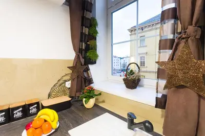a kitchen with a window and a sink and a counter top at Sweet getaway apartment - central & parking in Ljubljana
