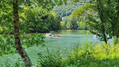 a group of people in boats on a river at Vila Rozi, Osilnica - vacation house Pr' Vili Rozi in Osilnica