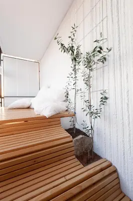 a room with a bed and plants on the wall at Bright Penthaus Apartement, with a wonderful view in Ljubljana