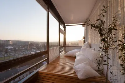 a balcony with pillows and a view of a city at Bright Penthaus Apartement, with a wonderful view in Ljubljana