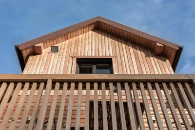 a wooden tower with a window on top of it at House Storz in Pohorje