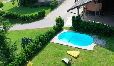 an overhead view of a swimming pool in a yard at Farmhouse Lipoglav in Loče pri Poljčanah