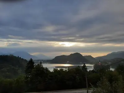 a view of a lake in the middle of mountains at Apartments Barbi in Bled