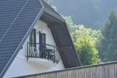 a balcony of a house with a window at Penzion Zaka in Bled