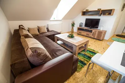 a living room with a large couch and a table at Apartment A1 in Ljubljana