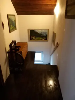 a view of a room with a table and a painting at Holiday Home NA VASI in Gorenja Vas