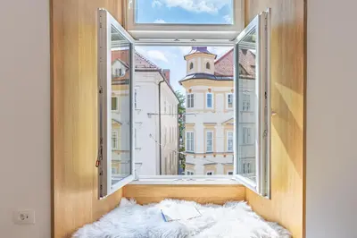 an open window with a view of a city at Old Quarter Residence in Ljubljana