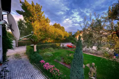 a view of a garden with a toilet in a yard at Studio Southwest 3 with AirCon & FREE Parking in Ljubljana