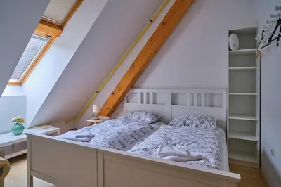 a bedroom with a bed in a attic at Samostan Mekinje in Kamnik