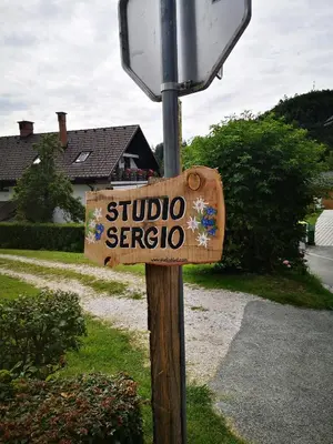 a sign that says studio serio on a pole at Studio Sergio in Bled