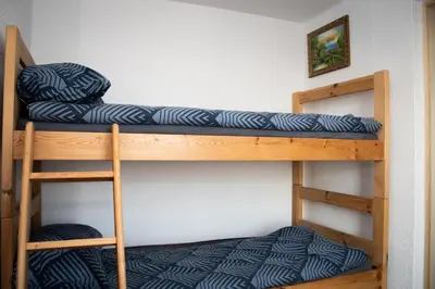 a bunk bed in a room with a bunk bed gmaxwell gmaxwell gmaxwell at Vineyard Paradise Senica in Dramlje