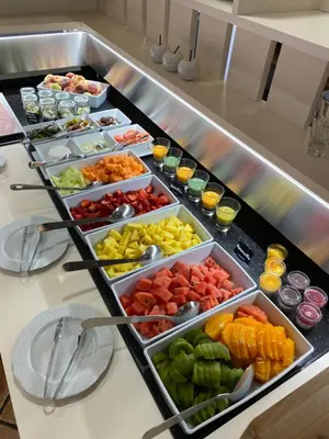 a buffet line with different types of fruits and vegetables at Hotel Grahor Depandance in Sežana