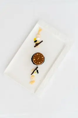 a white plate with food on top of it at Hotel Grahor Depandance in Sežana