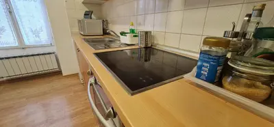 a kitchen with a sink and a counter top at APARTMA DOMENIKA in Ptuj