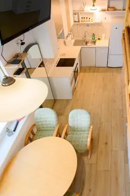 an overhead view of a kitchen with a table and chairs at APARTMA RANČ LUŽE in Kranj
