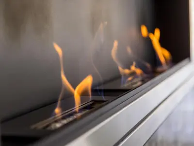 a close up of a stove with flames in it at Reset Apartments in Kranjska Gora