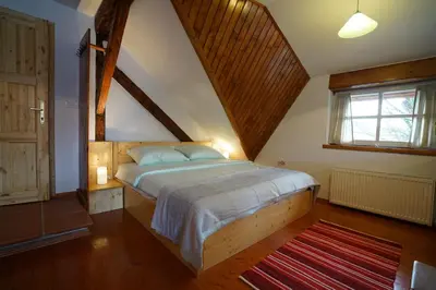 a bedroom with a large bed in a attic at Martin's Hidden Garden in Ljubljana