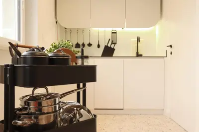 a kitchen with a stove with pots and pans at Eagle's Nest Ljubljana in Ljubljana