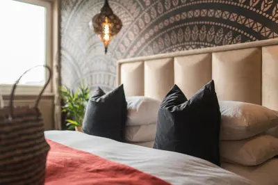 a bedroom with a bed with pillows on it at Eagle's Nest Ljubljana in Ljubljana