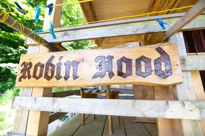 a wooden sign that says boom house at Glamping Laze in Gorenja Vas