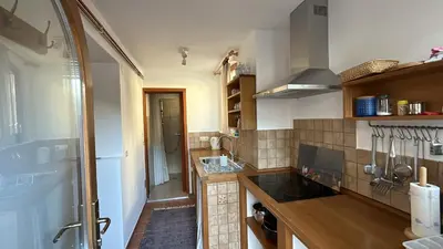 a kitchen with a sink and a stove top oven at Apartment Erlah in Rateče