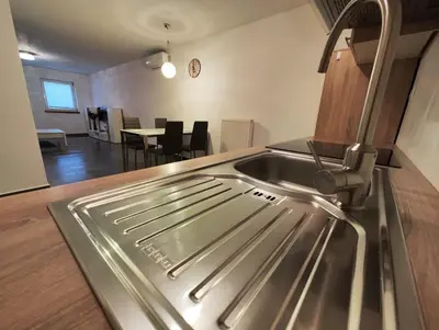 a kitchen with a sink and a counter top at Goriška Apartments in Ajdovščina