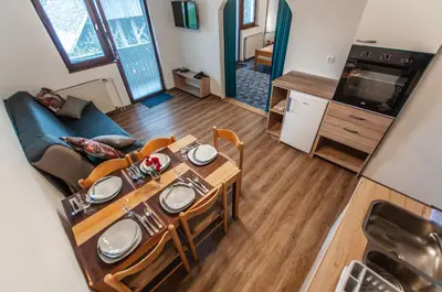 an overhead view of a living room with a table and chairs at Apartments Jože Pekovec in Bohinj