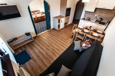 an overhead view of a living room and kitchen with a couch at Apartments Jože Pekovec in Bohinj