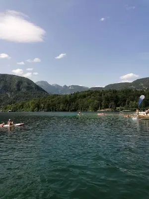 a group of people kayaking on a lake at Accommodation Destina, LAKE BOHINJ in Bohinj