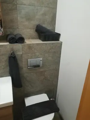 a small bathroom with a toilet and a towel at Place near Casino Mond - Apartma Urška in Šentilj
