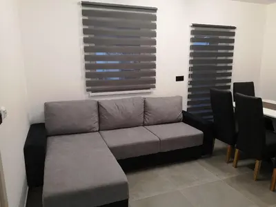 a living room with a couch and some chairs at APP Aleksa 6168 in Čatež ob Savi