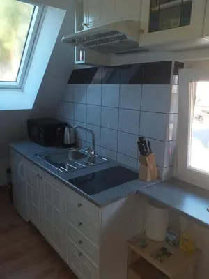 a kitchen with a sink and a counter top at ODAI in Bovec