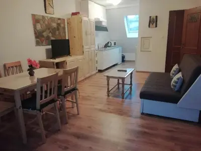 a living room with a table and a couch at ODAI in Bovec