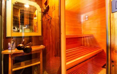 a wooden sauna with a bench and a sink at Amazing Home In Tolmin With Sauna in Tolmin