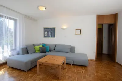 a living room with a couch and a table at Apartment Melody Bled in Bled