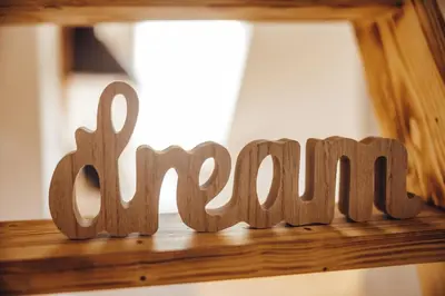 a wooden sign that says summer sitting on a shelf at Drive Caffe Apartments in Trzin