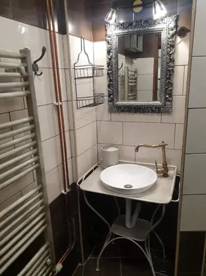 a bathroom with a sink and a mirror at Apartma Miša, Tomo Ketiš sp in Prevalje