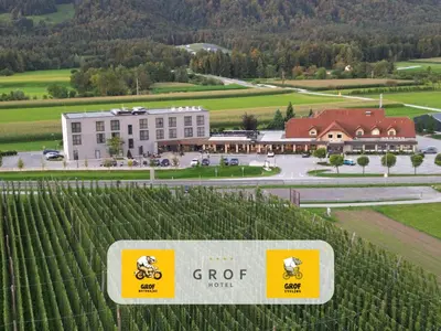 a sign in front of a building with a vineyard at Hotel Grof in Vransko