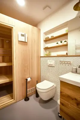 a bathroom with a toilet and a sink at FERN apartments in Maribor