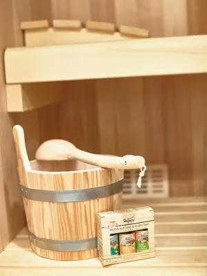 a wooden spoon in a wooden basket next to a box at FERN apartments in Maribor