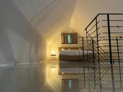 a bedroom with a bed and a mirror on the floor at GORIČKE IŽE in Križevci