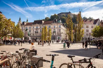 a group of bikes parked in a city square at City Center Apartment with Parking in Ljubljana