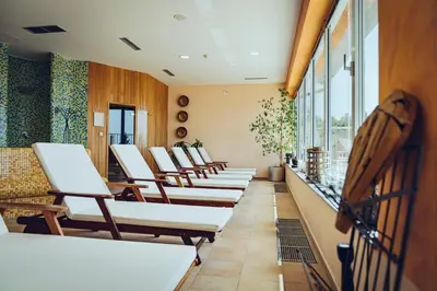 a row of chairs in a waiting room at Pohorje Village Wellbeing Resort - Family Apartments Bolfenk in Pohorje