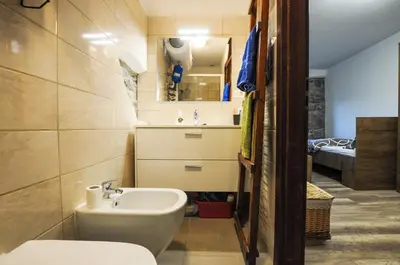 a small bathroom with a sink and a toilet at Barbara`s Village House in Ilirska Bistrica