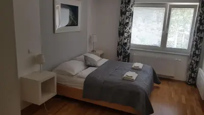 a bedroom with a bed with two towels on it at Bled Apartments in Bled